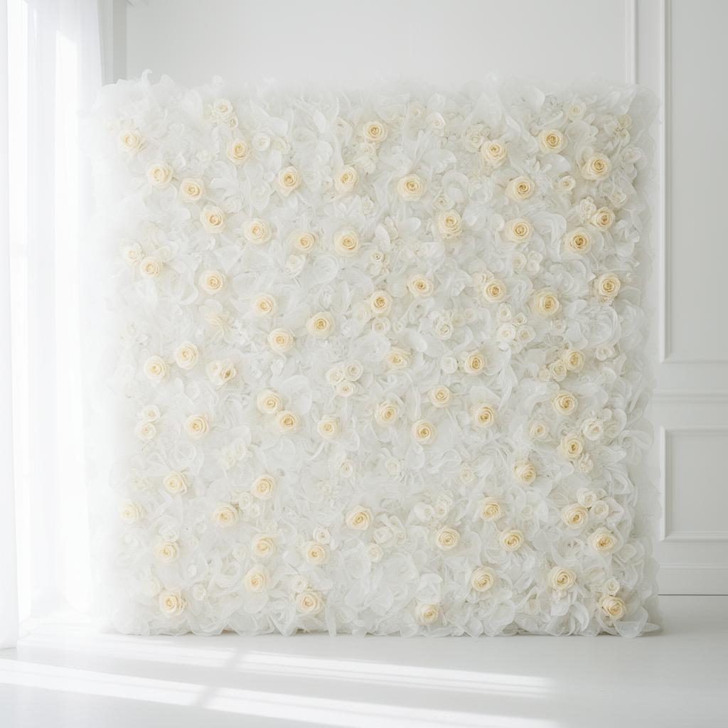 Ethereal all-white silk flower wall with delicate cream roses in bright airy light